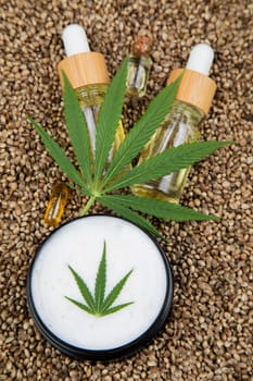 Cbd oil and marijuana plant, hemp seeds, medical marijuana concept