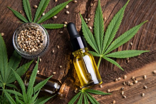 Cannabis oil bottle and marijuana leaves
