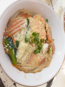 Fried pork cutlet (tonkatsu) with egg topping on steamed rice, stock photo
