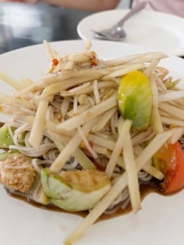 Thai papaya salad hot and spicy mixed from variety of vegetable, stock photo