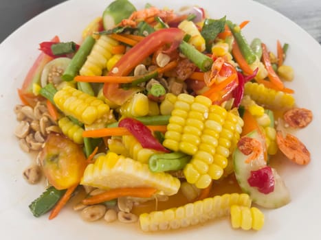 Thai papaya salad hot and spicy mixed from variety of vegetable, stock photo