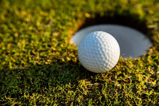 Sport and lifestyle, Golf ball on green grass on course