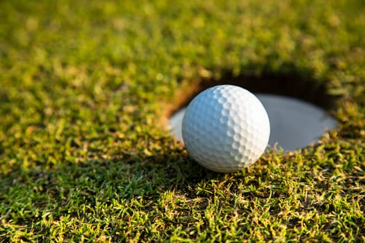 Sport and lifestyle, Golf ball on green grass on course