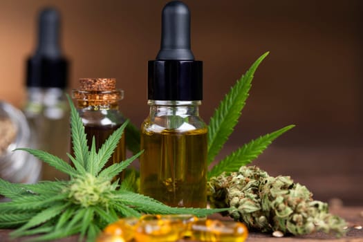 Cannabis oil bottle and marijuana leaves