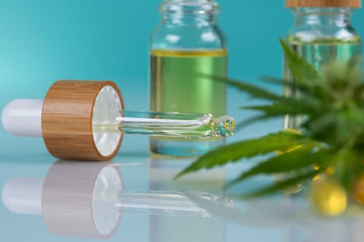 Set of essential oil cbd in a glass bottle, with a pipette, marijuana concept
