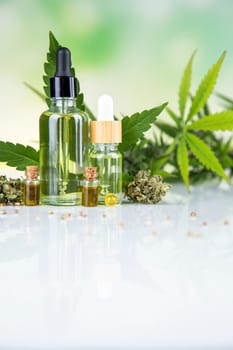 Hemp cbd oil, cannabis leaves, hemp seeds and bottles of oil
