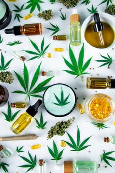 Cannabis hemp oil bottle with hemp seeds, hemp leaf, cannabis oil and marijuana