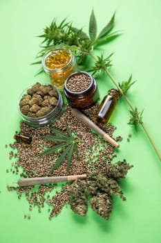 Marijuana buds with cannabis leaves on cbd concept