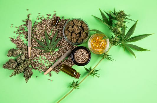 Marijuana buds with cannabis leaves on cbd concept