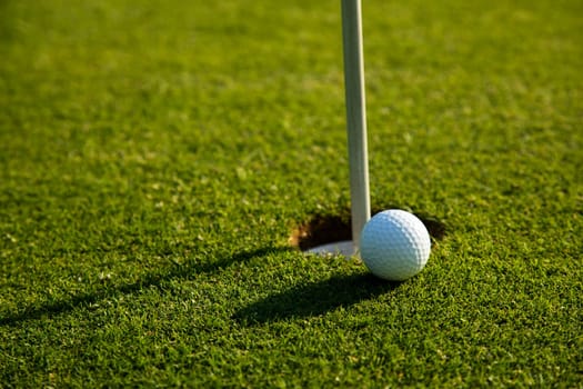 Sport and lifestyle, Golf ball on green grass on course