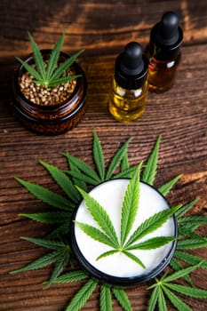 Cbd hemp cosmetics, oil in bottle and marijuana