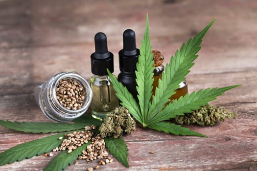 Hemp oil and marijuana leaves on extract cbd