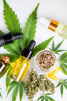 Bottles with hemp oil and cannabis leaves, marijuana