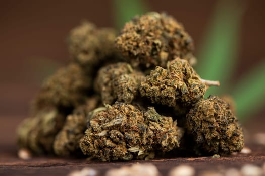 Top view of marijuana leaves and cannabis buds