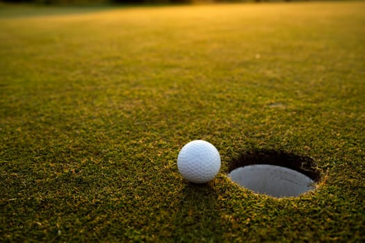 Close up of golf ball on green grass, Sport and lifestyle