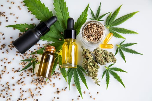 Bottles with hemp oil and cannabis leaves, marijuana