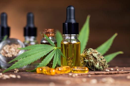 Cannabis oil bottle and marijuana leaves
