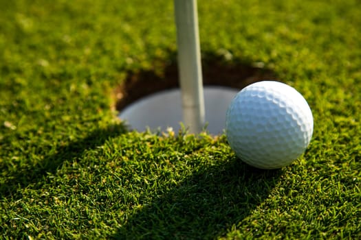 Sport and lifestyle, Golf ball on green grass on course