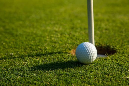Sport and lifestyle, Golf ball on green grass on course