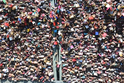 Cologne,Hohenzollern Bridge,Germany. A love lock is a padlock that lovers traditionally attach to gates and bridges to symbolically seal their eternal love.