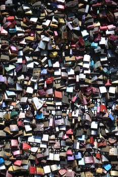 Cologne,Hohenzollern Bridge,Germany. A love lock is a padlock that lovers traditionally attach to gates and bridges to symbolically seal their eternal love.