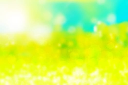 Abstract gradient light blue turquoise yellow green shiny blurred background texture with circular bokeh lights. Beautiful fresh backdrop. Space for design.
