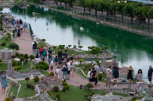 Viserba, Italy - June 25, 2024: People going at Theme park Italy in Miniature or Italia in Miniatura in Rimini, Italy - Reproduction of famous attractions in a small scale
