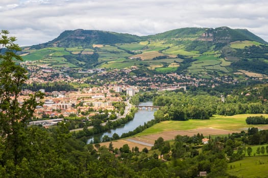 View over Millau town with Causse du Larzac limestone plateau, listed as UNESCO World Heritage Site. Department of Aveyron, France