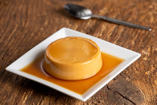 french flan on dark wood