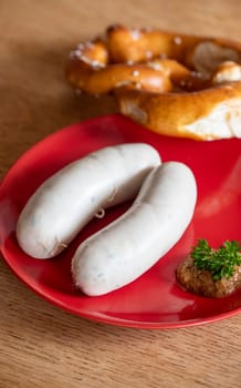 pair of bavarian white sausages on plate