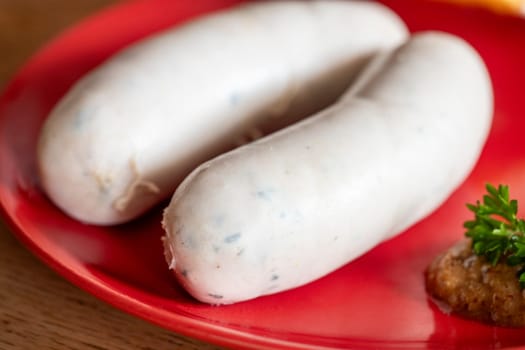 pair of bavarian white sausages on plate