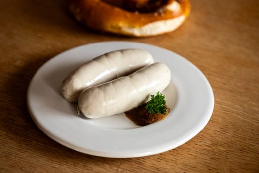 pair of bavarian white sausages on plate