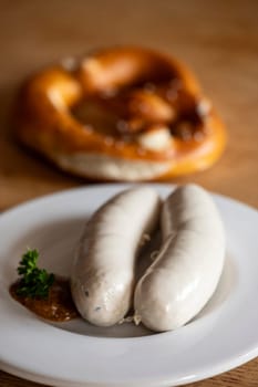 pair of bavarian white sausages on plate