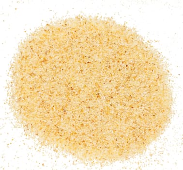 Raw wheat cereal scattered, white background