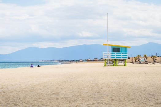 Lifeguard tower and beach at the coastline of the Mediterranean sea in Port Barcarès, France