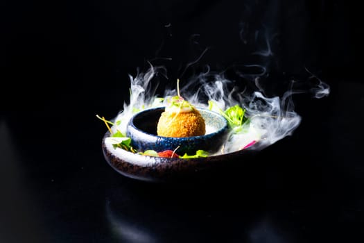 Closeup of some spanish croquettes in bed of lettuce served as tapas