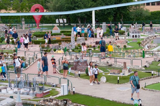 Viserba, Italy - June 25, 2024: People going at Theme park Italy in Miniature or Italia in Miniatura in Rimini, Italy - Reproduction of famous attractions in a small scale