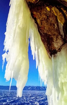 Winter on the Baikal, ice and snow on the lake. The beauty of the nature of Baikal in winter.