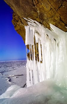 Winter on the Baikal, ice and snow on the lake. The beauty of the nature of Baikal in winter.