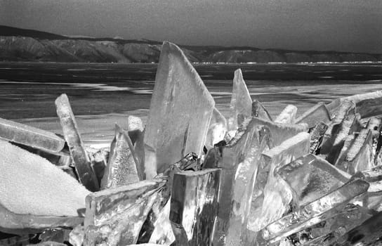 Winter on the Baikal, ice and snow on the lake. The beauty of the nature of Baikal in winter.