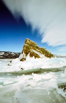 Winter on the Baikal, ice and snow on the lake. The beauty of the nature of Baikal in winter.