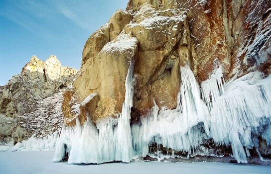 Winter on the Baikal, ice and snow on the lake. The beauty of the nature of Baikal in winter.