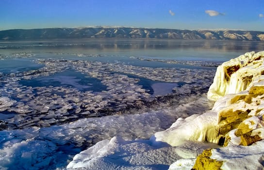 Winter on the Baikal, ice and snow on the lake. The beauty of the nature of Baikal in winter.