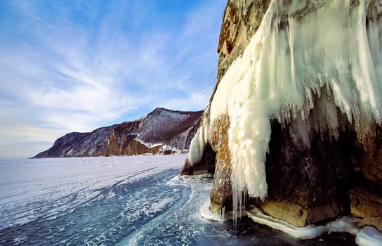 Winter on the Baikal, ice and snow on the lake. The beauty of the nature of Baikal in winter.