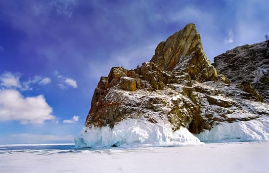 Winter on the Baikal, ice and snow on the lake. The beauty of the nature of Baikal in winter.