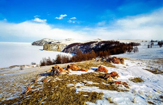 Winter on the Baikal, ice and snow on the lake. The beauty of the nature of Baikal in winter.