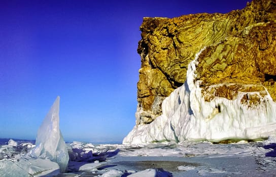 Winter on the Baikal, ice and snow on the lake. The beauty of the nature of Baikal in winter.