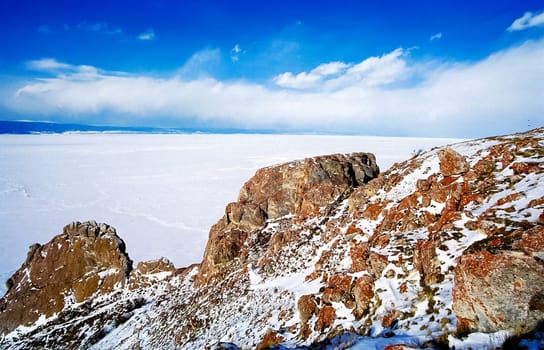 Winter on the Baikal, ice and snow on the lake. The beauty of the nature of Baikal in winter.
