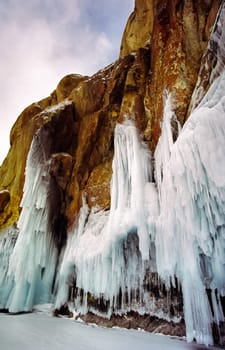 Winter on the Baikal, ice and snow on the lake. The beauty of the nature of Baikal in winter.