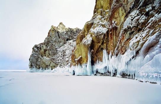 Winter on the Baikal, ice and snow on the lake. The beauty of the nature of Baikal in winter.